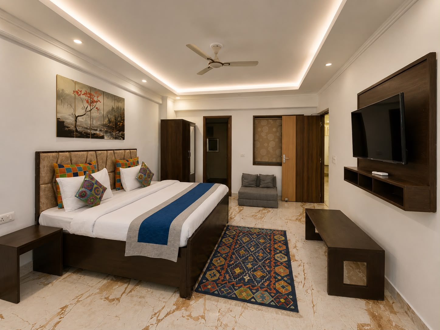 Spacious bedroom with patterned rug at Aloha Oasis