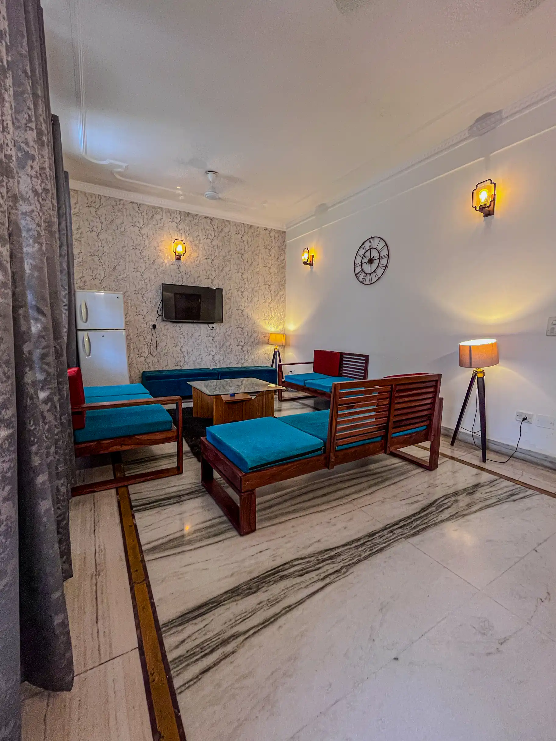 Living room with TV and seating at Ganges Grace